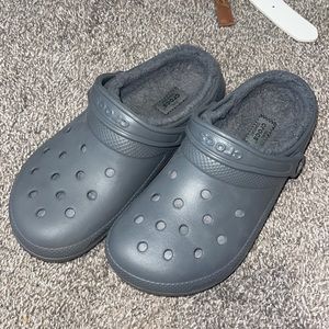 Grey crocs with fur